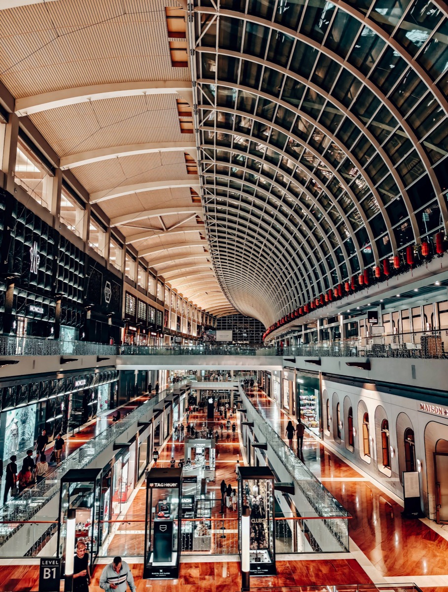 The Shoppes at Marina Bay Sands, with a curved glass ceiling above several levels of retail storefronts